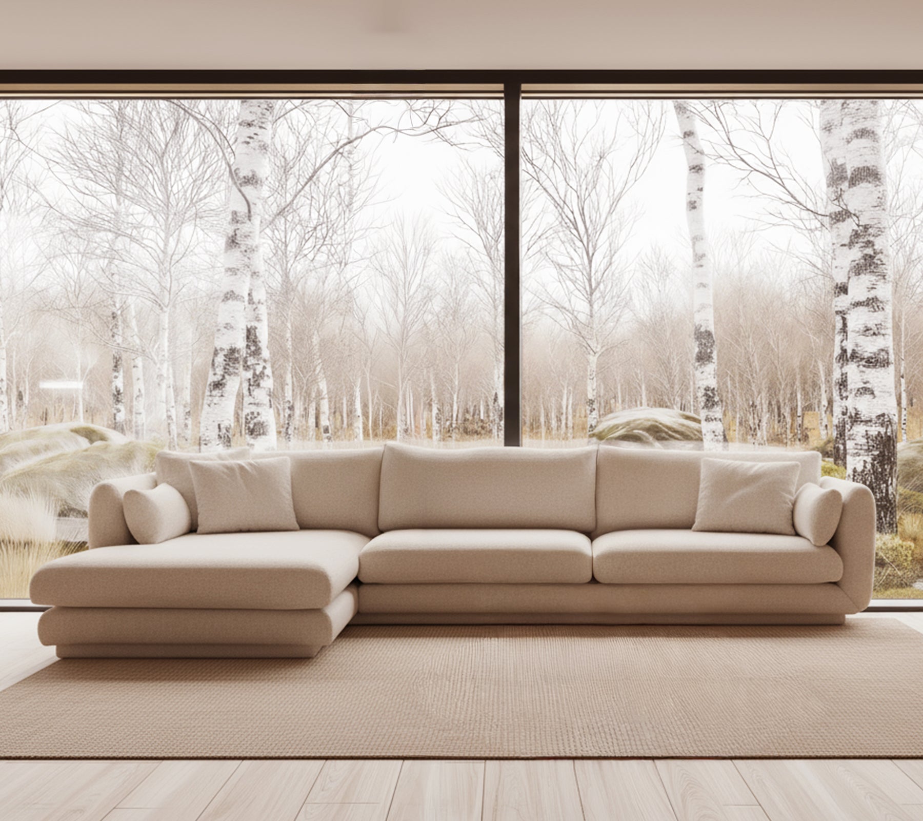 Sofá moderno beige en un entorno de salón brillante con grandes ventanas.