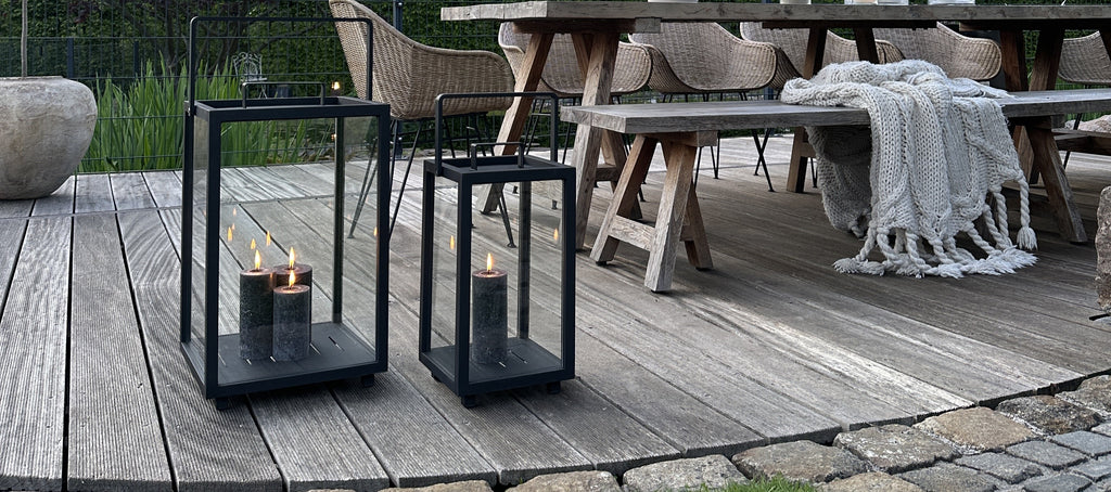 Black outdoor lantern with grey liten candle lights