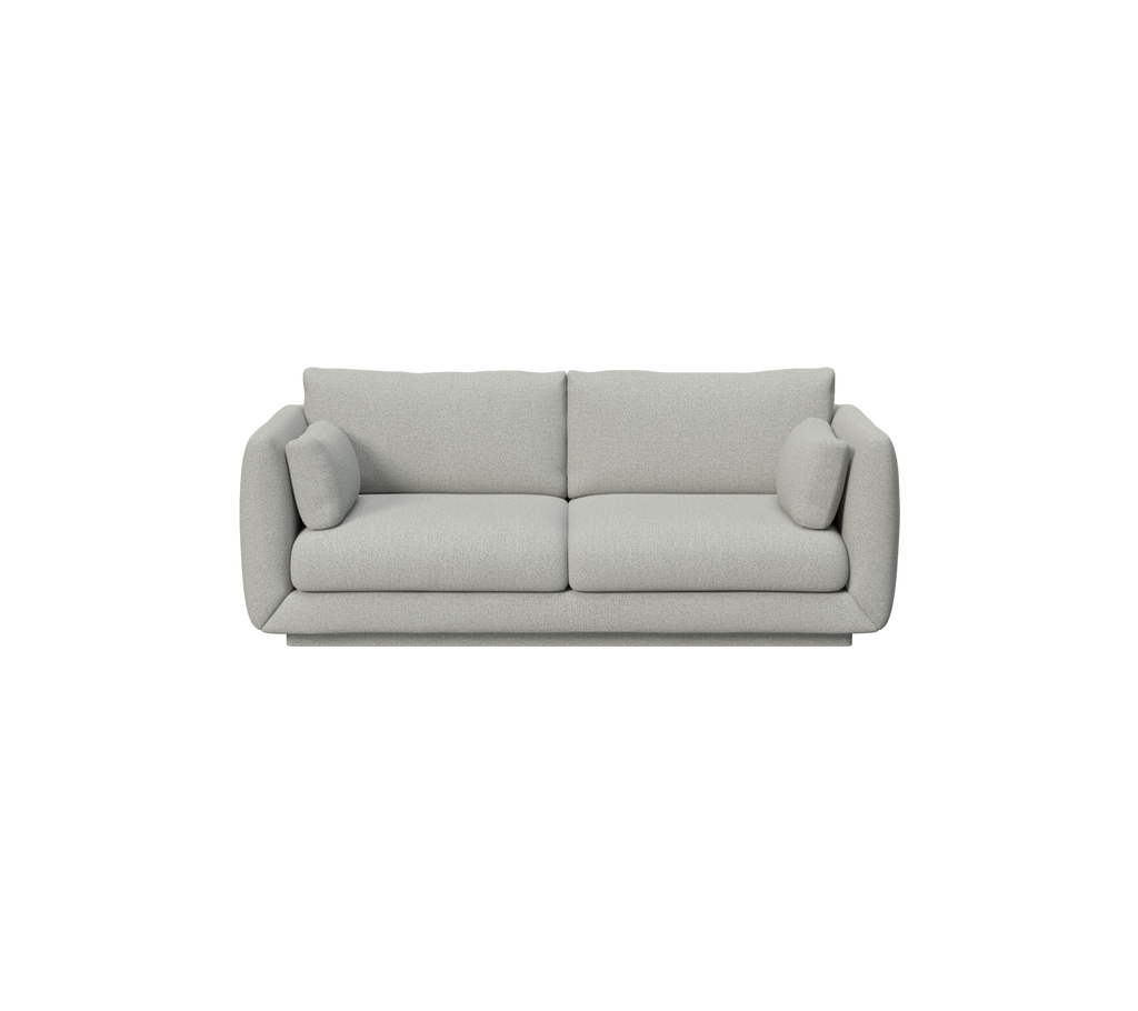 Sofá gris claro con diseño minimalista y cojines redondeados.