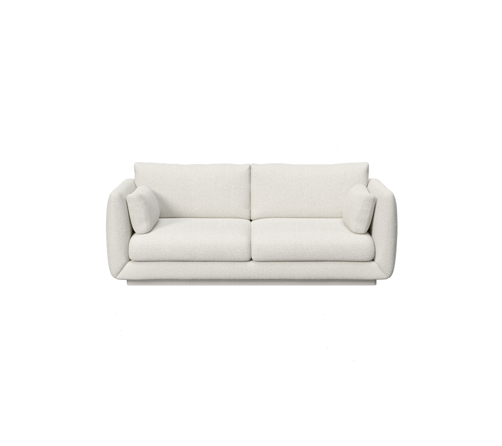 Sofá moderno minimalista blanco con brazos redondeados y cojines suaves.