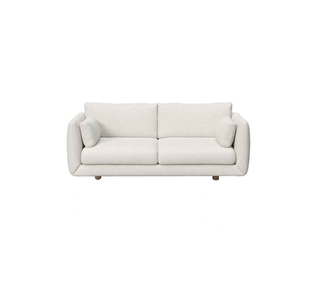 Sofá blanco moderno con dos cojines.