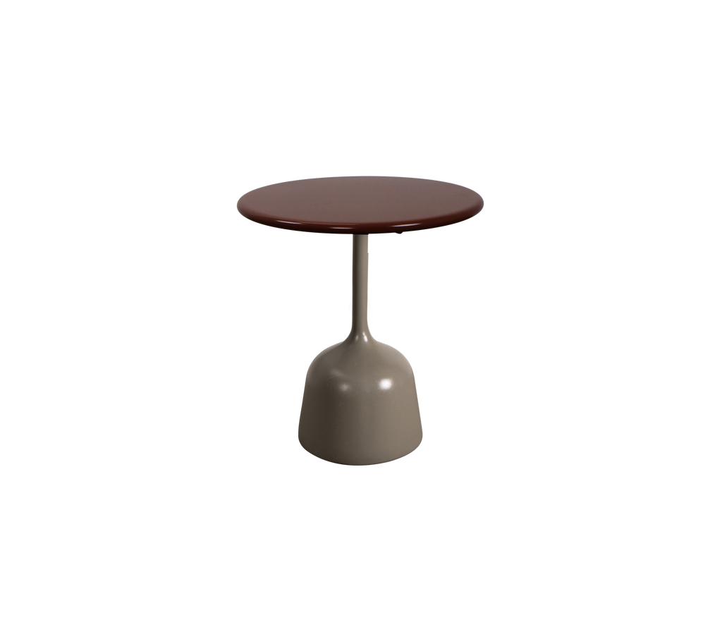 Mesa redonda burdeos con una base taupe.