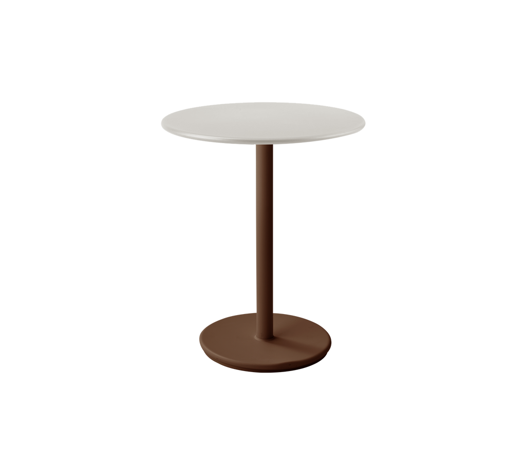 Mesa blanca moderna con base roja desierto en un ambiente de salón elegante.