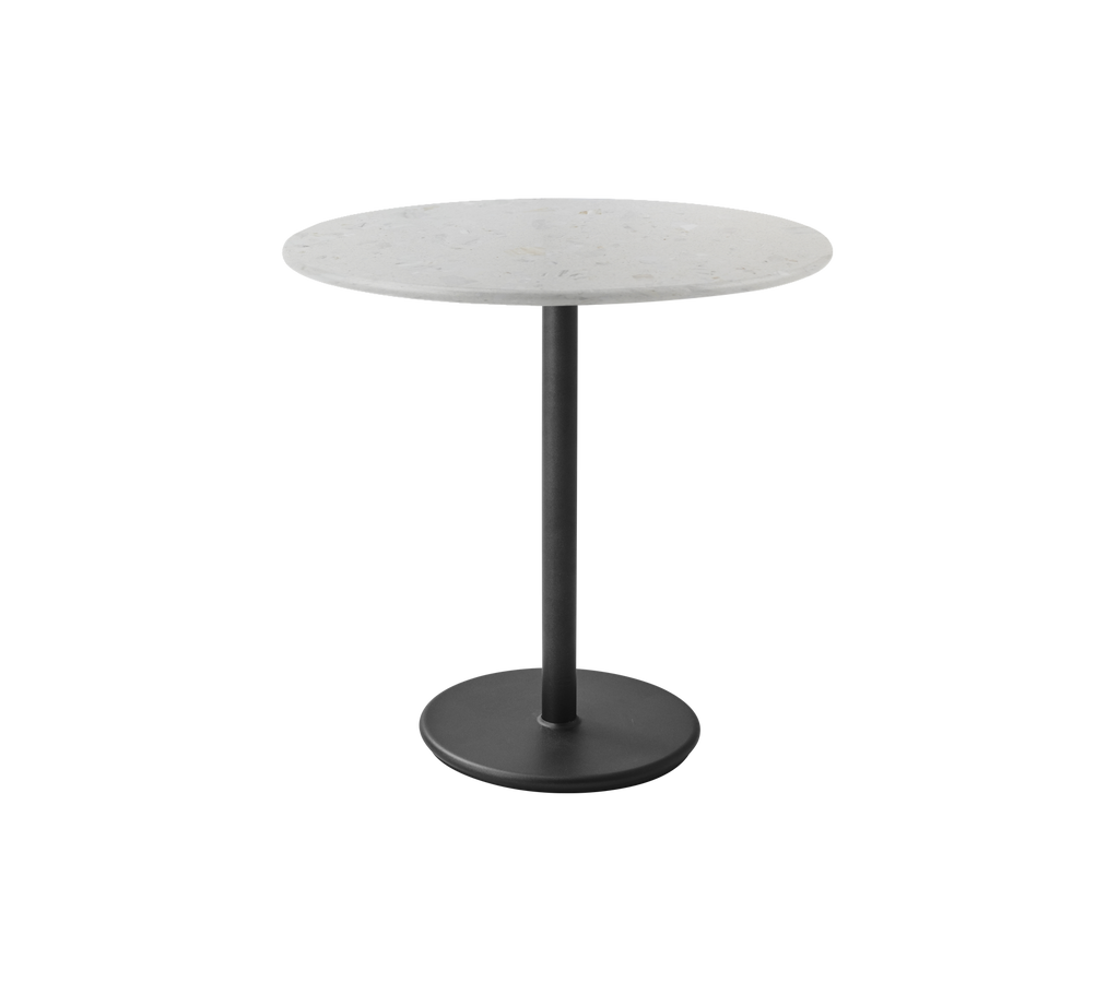Mesa redonda gris con una base de pedestal negra en un diseño moderno.