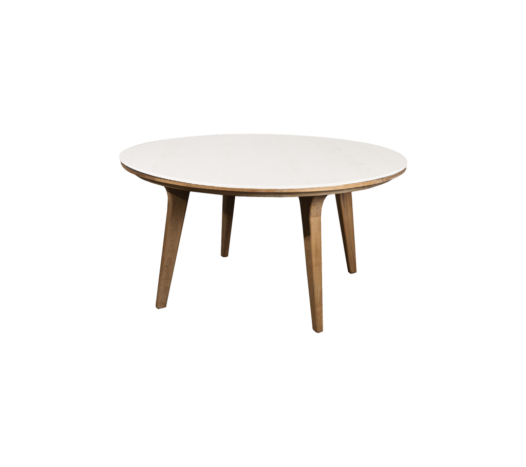 Mesa redonda con una superficie blanca lisa y patas de madera, ideal para cenar o reuniones informales. Diseño elegante y contemporáneo.