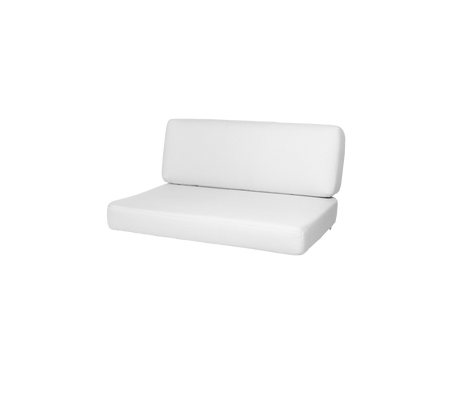 Sofá blanco de dos piezas con un diseño simple y moderno, que cuenta con un respaldo bajo y un asiento cómodo. Ideal para una estética minimalista.