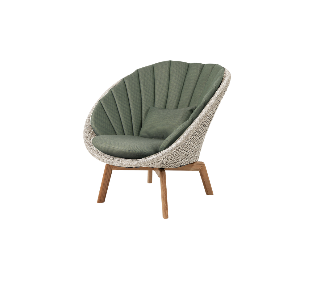 Silla de lounge moderna verde con un diseño único.