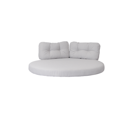 Asiento redondo acolchado con dos cojines de respaldo de apoyo en un color neutro, diseñado para la comodidad y la relajación.