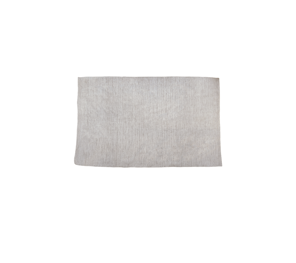 Producto de arena multicolor exhibido sobre un fondo liso.