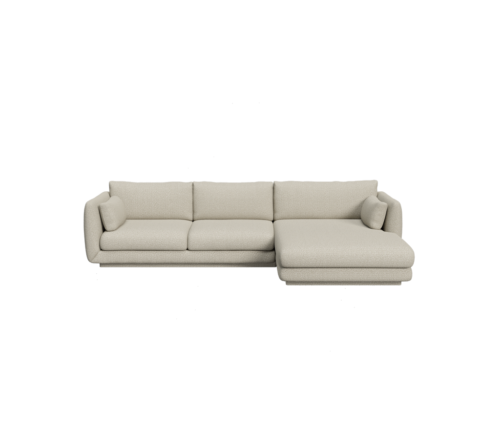 Sofá seccional marrón claro con un diseño minimalista.