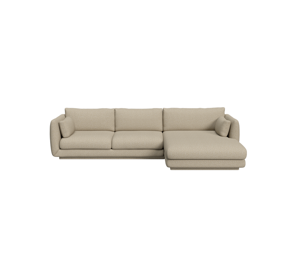 Sofá moderno marrón con un chaise en un entorno de salón.