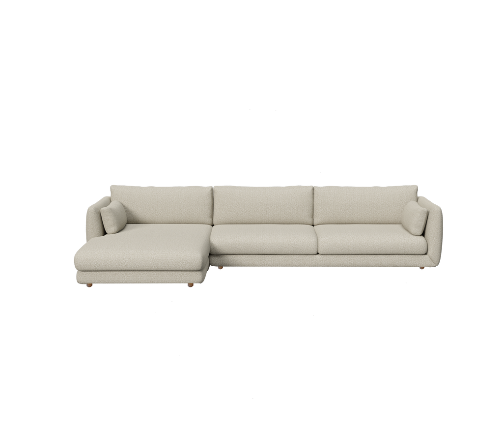 Sofá moderno marrón claro con un chaise longue en un diseño minimalista.