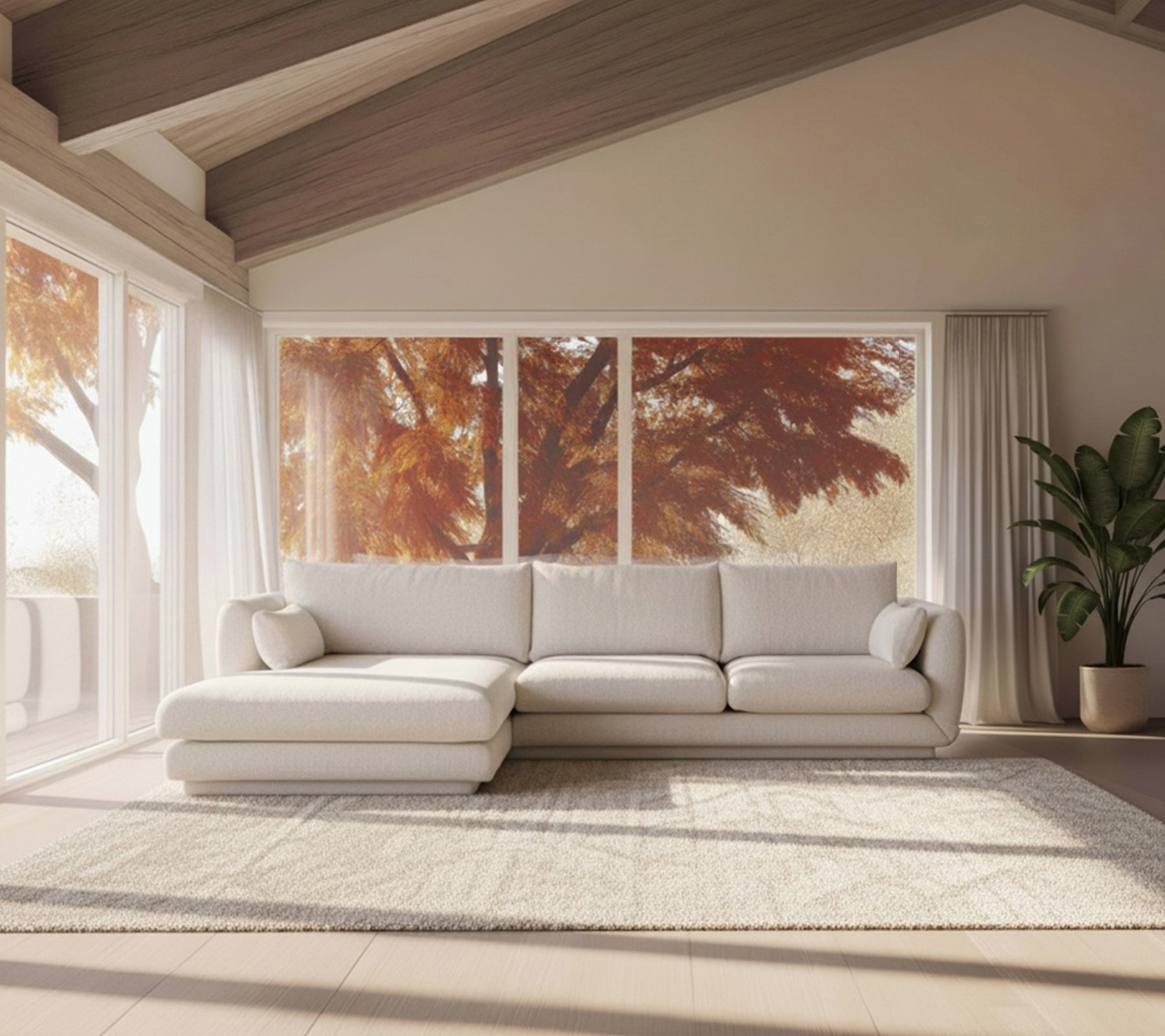 Sofá blanco moderno y alfombra beige en un ambiente de salón minimalista.