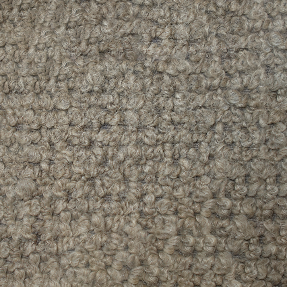 Tela beige texturizada en primer plano.